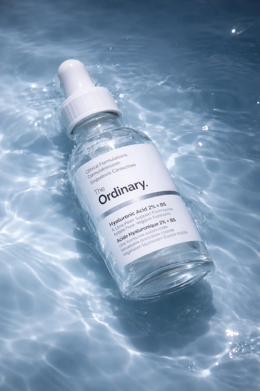 The Ordinary Hyaluronic Acid 2% + B5 serum lying in blue rippling water.